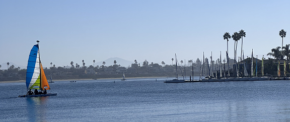 Photo that I took while enjoying my Saturday on Mission Bay in San Diego, California. The photo shows the blue waters of the bay, a clear sky, and a small boat cruising the water.